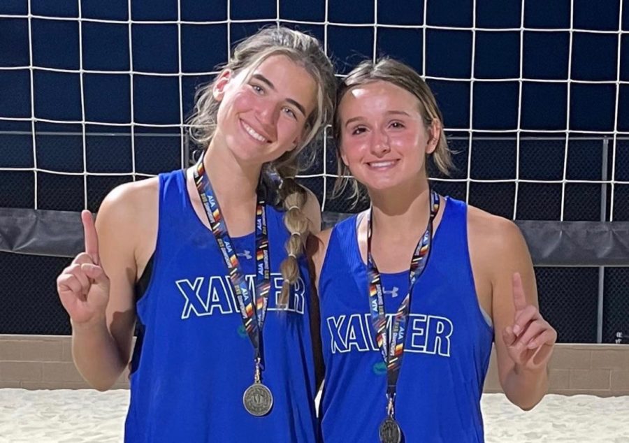Landree Coats ‘22 and Summer McCann ‘23 pose with their medals after winning the beach volleyball pairs state championship on May 5. 