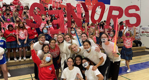 Senior STUCO poses in front of the senior class before a recent rally. Rallies are a beloved Xavier tradition, especially for seniors. 