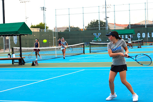 In a singles match against Perry High School, Ali Blutstein returns Perry’s serve from the backcourt. Xavier won the game 6-3. 