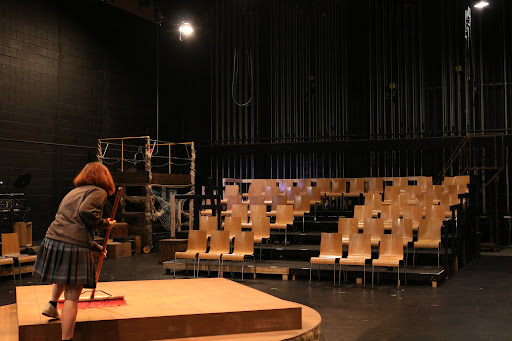 As tech week begins, junior Hope Smith sweeps up the stage to prepare for the rehearsal that is soon to begin. This stage will soon be filled with a lively cast performing “Peter and the Starcatcher.”