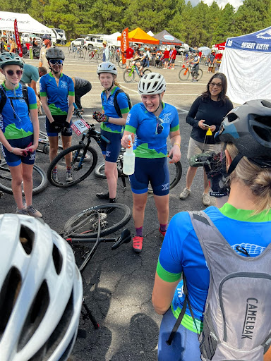 Xavier mountain biking captain Grace Morgan blesses the teams’ bikes in preparation for their races. This team tradition was started this year.