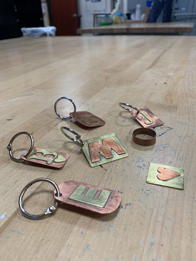 Students from Xavier’s Jewelry and Metalworking class experience a new style of art. Using different materials, they create everyday accessories that they can display on bags or wear with outfits at school or in public. 