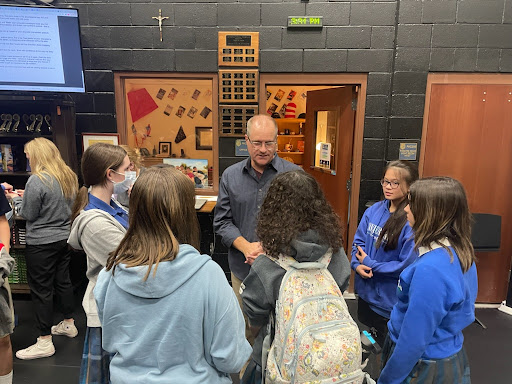 Students gather around to learn new techniques and information that will help them in the audition process. Director Mark Stoddard guides them through any questions they have, while providing tips to improve their acting. 