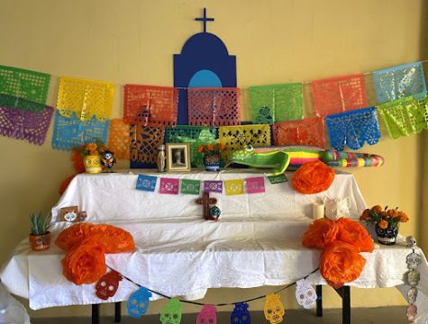 The vibrant and colorful ofrenda made by the We Are Xavier (WAX) club is in the midst of its preparation as it awaits more decorations and pictures. This is just one of the many Día de los Muertos elements that adorned Xavier’s campus from October 24 to November 2. 