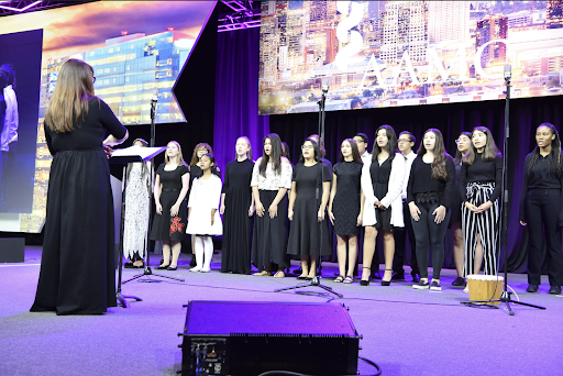 Rosie’s House choir performs during one of its two concerts of the year. Members would not have been able to prepare for this touching performance without the opportunity of free lessons given by Rosie’s House.  