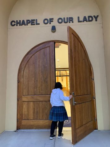 Olivia Fisko ‘25 enacts a morning scene of walking into The Chapel of Our Lady. Daily Masses are held there on Xavier’s campus, allowing students to sit quietly with God and listen to His call.