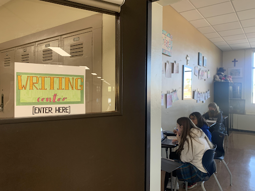 Junior MJ Martinez ‘24 helps Maggie Olsen ’25 perfect her essay. While currently it is only available to sophomores, the center will soon be open to any student who needs it.