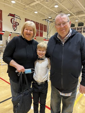 Arizona Republic and Xavier sports writer Don Ketchum with his wife Carol and grandson. Xavier will miss Ketchum deeply, as the community and his family mourn his passing.