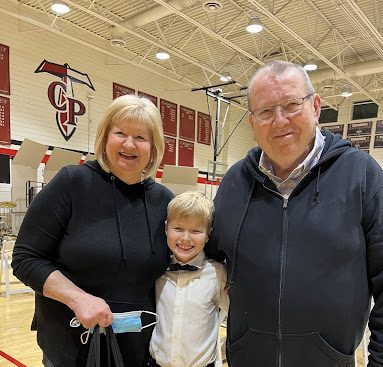 Arizona Republic and Xavier sports writer Don Ketchum with his wife Carol and grandson. Xavier will miss Ketchum deeply, as the community and his family mourn his passing.