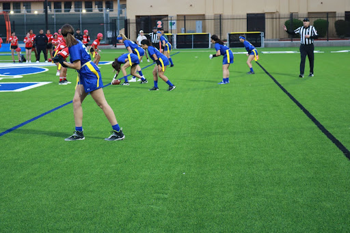 The flag football team prepares a scrimmage play. Frosh center Mikayla Patterson prepares to snap the ball as the Gators begin the offensive play against Agua Fria.