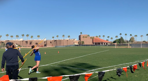 Callie Ehmann preps her stance as she prepares for her official javelin throws. She loads her arm and is ready to launch. 