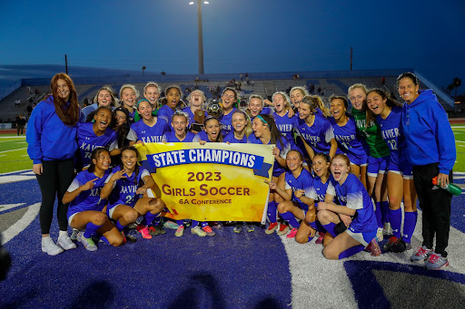 No.1 Xavier College Preparatory’s varsity soccer team poses with the 6A State Champions banner. It has just won Xavier’s 13th girls soccer state title with a 4-1 victory over No. 2 Perry High School. 