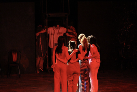 On opening night, in the second act of “Godspell,” cast members are seen surrounding the image of Jesus on the cross. The cast had a successful debut on the Brophy Black Box stage and was greeted with a large turnout and enthusiastic crowd. 