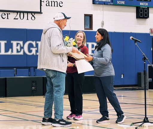 Coach Brian Trapp receives an acknowledgement of his induction award at Xavier College Prep on March 30, 2023. He was recognized at Xavier’s spring sports rally.