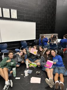On Thursday, September 7, Xavier girls make friendship bracelets and signs for the new Gator-Aide club. This was the first meeting and over 150 girls showed up. 