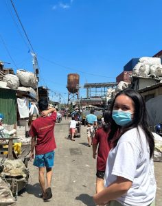 Mangundayao walks through Happy Land’s streets, ready to distribute all of her collected donations to the children. Tondo, Manila is home to many communities in dire need for clothes and other necessities. (Photo courtesy of Edna Mangundayao)