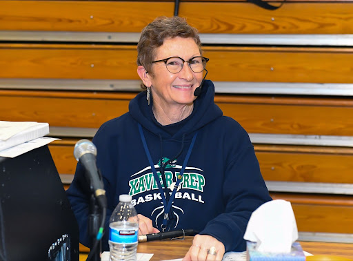Xavier College Preparatory hosts a home basketball game where Ronna Layne provides coverage as a public address announcer. Through finding the correct balance between enthusiasm and accuracy, she sets an example for the future of women in sports broadcasting. (Photo courtesy of Mark Jones)