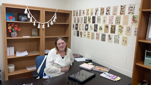 Sarah White sits at her desk in her office during break, before her theater class arrives. Her creatively-decorated room is a reflection of her artistic, bubbly personality. (Photo courtesy of Grace de Souza)
