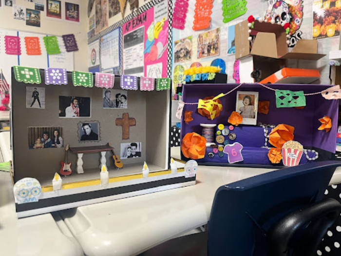 Alexandra Lopez Jimenez shows her students Día de los Muertos projects displayed in her classroom. Every year near the time of Day of the Dead, Lopez Jimenez makes her students create “Ofrendas” to present and share with the class. 