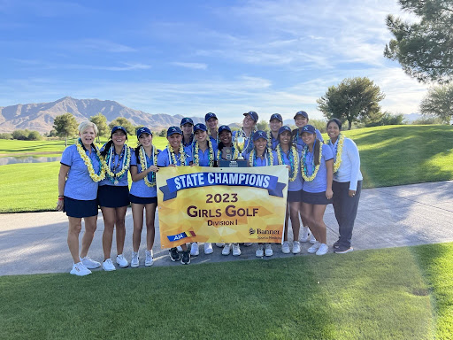 The girls’ golf team poses with its state championship banner and trophy. There are smiles all around as members wear their leis made by team member Reimi Bleyl ‘24. (Photo courtesy of Tui Selvaratnam)