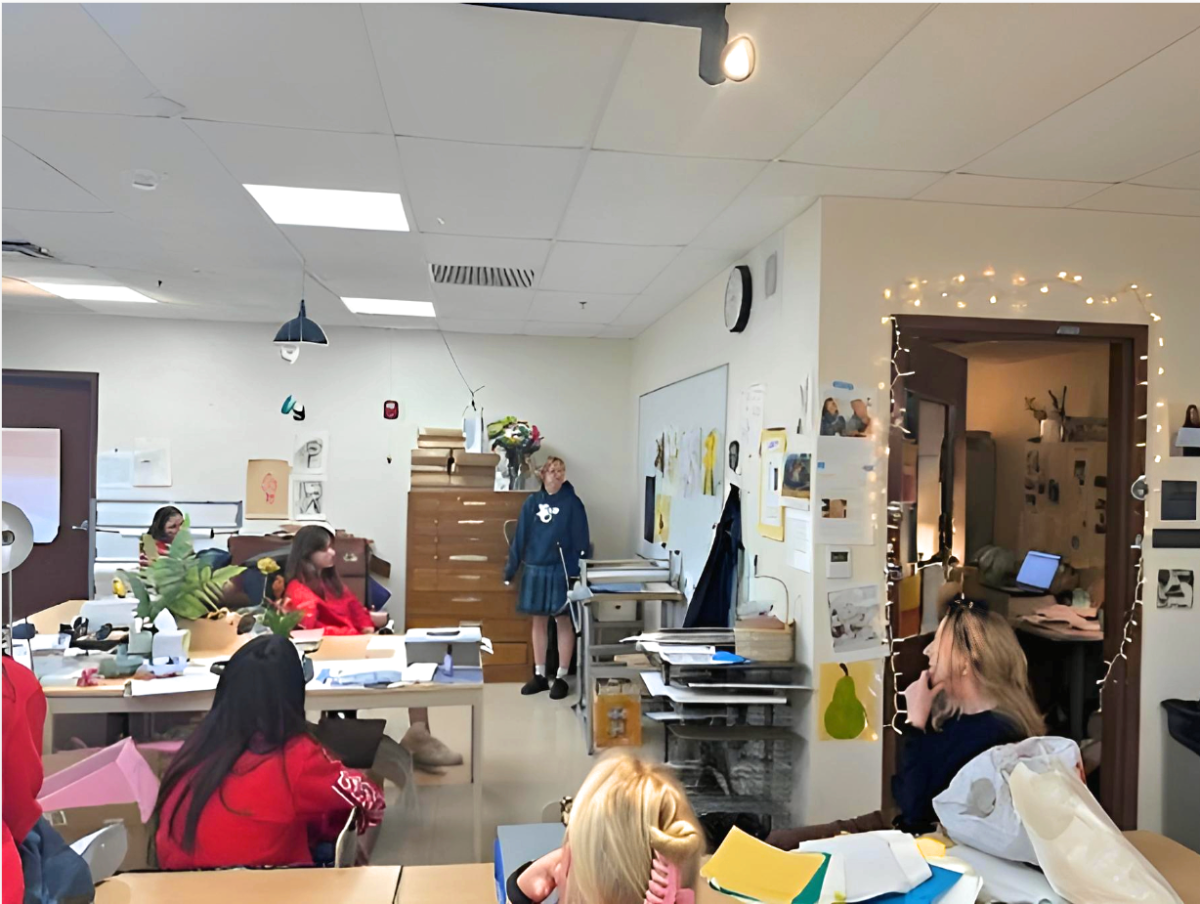 Young Xavier artists are hard at work in Alison Dunn’s AP Studio Art class presenting their latest creations to be critiqued. This year, Dunn encouraged students to incorporate red string into their works at least once.  (Photo courtesy of Jane Burkhardt)