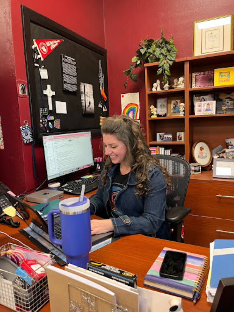 Brittany Ecker handles some principal responsibilities before her third period theology class. As teacher, Ecker has cultivated a peaceful and welcoming environment in her Fitzgerald  classroom. 