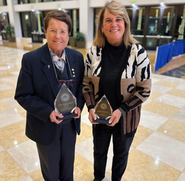 Sister Lynn Winsor holds the Leslie Moore Legacy Award. This award was given to Winsor by Global Community Of Women In Sports in Orlando, Florida. (Photo courtesy of Jen Brooks)
