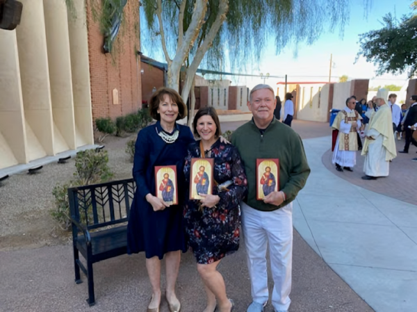 After 25 years of working at Xavier, Polly Fitz-Gerald, Stephanie Brugger and Kelly Fitzgerald celebrate their achievement at a Mass held in their honor. The Mass was conducted by Bishop John Dolan, where superintendent Domonic Salce awarded teachers plaques. (Photo courtesy of Tim Brugger)