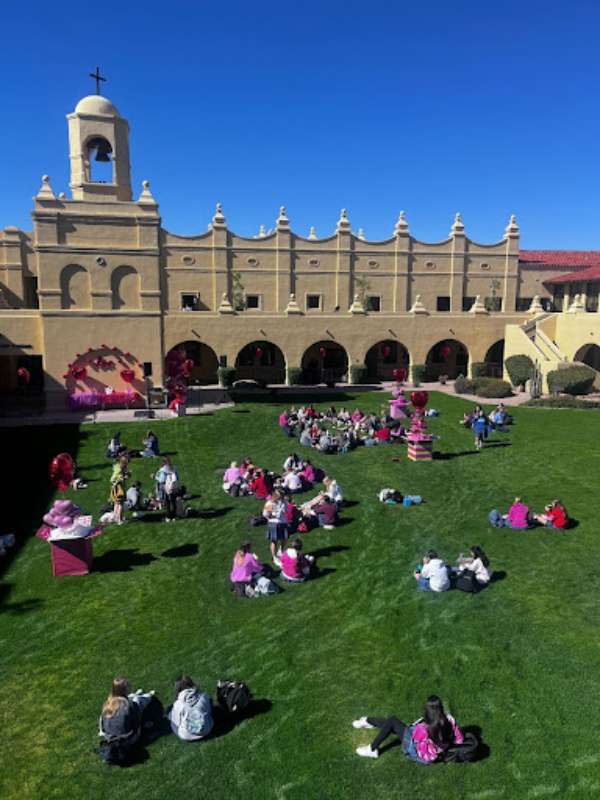 On February 13, Xavier students sit on the front lawn enjoying their lunch with the Valentine’s decorations around them. The decorations committee has volunteered their time to make the day special. 
