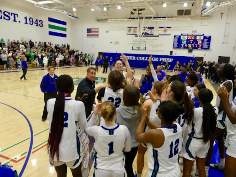 After+a+win+against+Sunnyslope+High+School%2C+the+basketball+team+gathers+around+in+celebration+over+their+win+against+Sunnyslope.+The+team+cheers+and+smiles+as+they+prepare+for+the+next+state+game.+%28Photo+courtesy+of+Zachary+Carlson%29