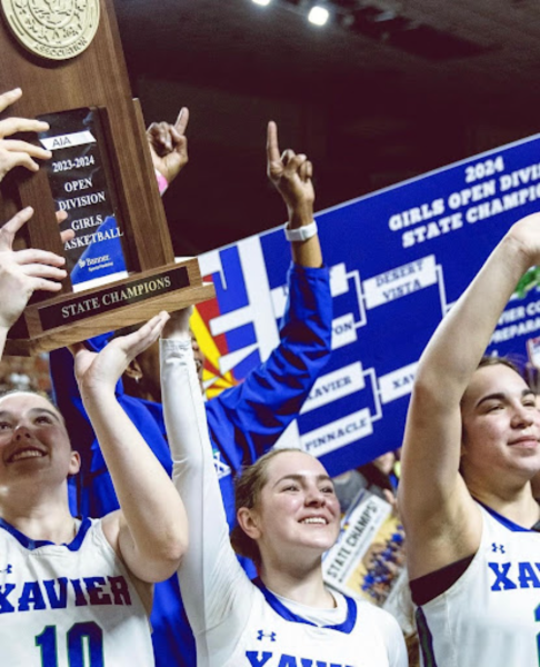 Basketball Gators Mo Ulrich ‘24, Lucy Sanford ‘25, and Dom Nesland ‘24 pose holding the 2024 State Championship trophy. This marked Xavier’s 153rd state championship and the first-ever basketball state championship. (Photo courtesy of Nero Nuez)