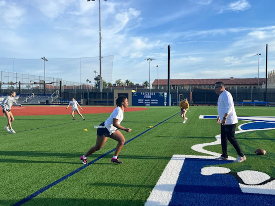 Michael Patterson leads morning drills with the Xavier flag football team. These pre-season practices prepare the team for the 2024-2025 season.