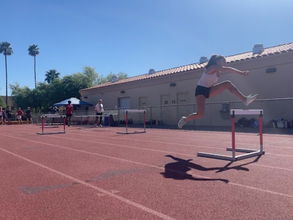 Mackenzie Lopez warms up by jumping hurdles at practice on Tuesday, April 16. The team was preparing for the Notre Dame Invitation on Friday, April 19.
