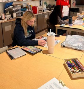 Senior Addelyn Pederson works diligently in her AP Studio class taught by Alison Dunn. She is working on a collage meant to symbolize societal pressure.