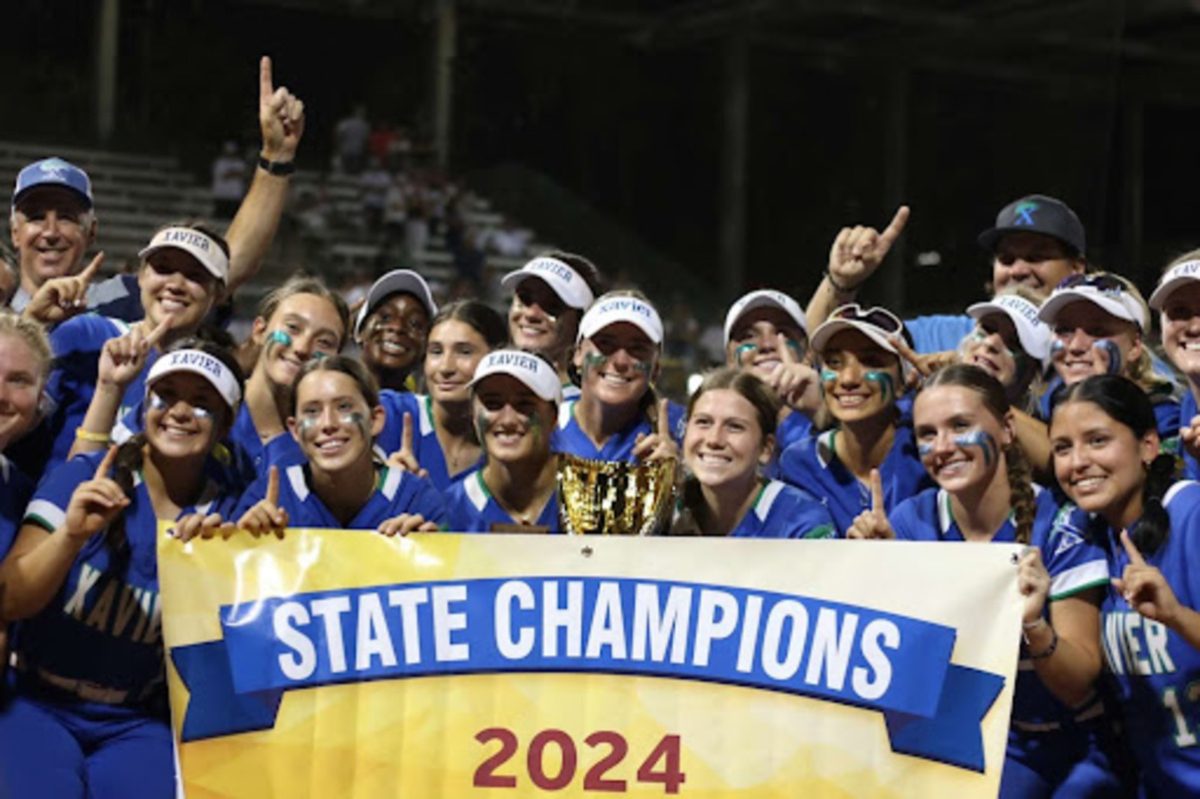 The softball team celebrates its 2024 season win. This committed team and coaching staff worked all spring long to leave as champions. 