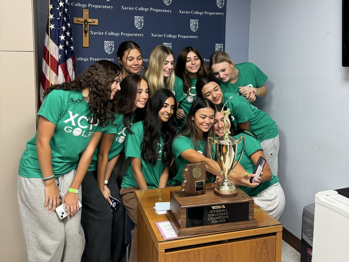 The 2024 Xavier varsity golf team poses for a selfie after it had been featured on the morning announcements celebrating its state championship. The Gators claimed their 39th golf state championship. 