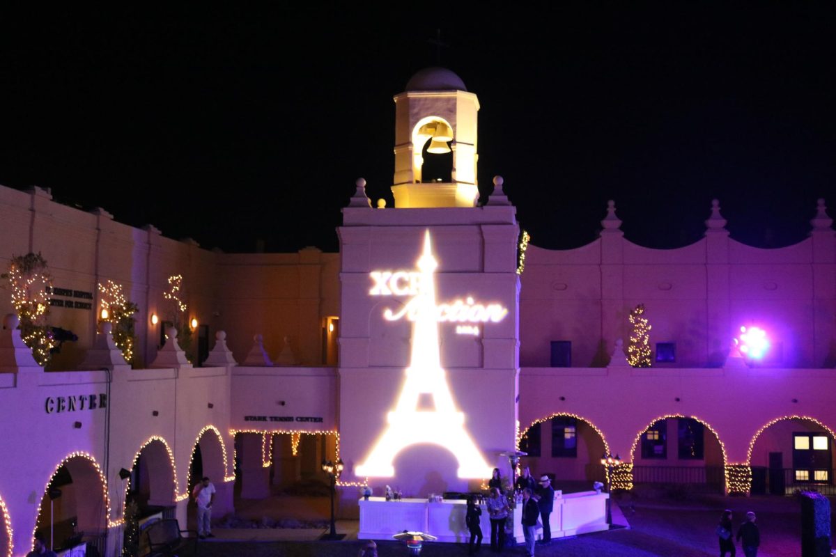 This year's auction theme was Parisian nights’ which was showcased throughout the event. One main display was the Eiffel Tower projected on the Xavier bell tower.