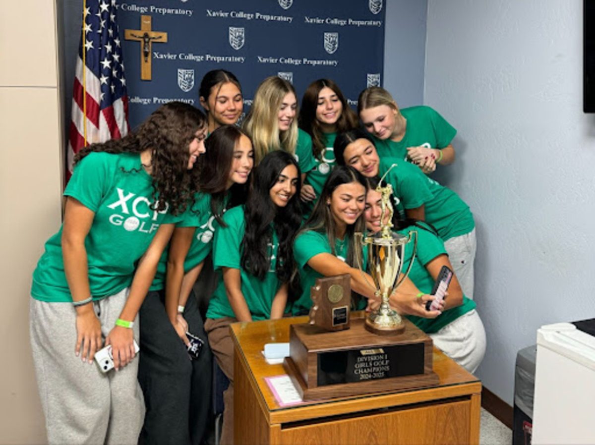 The 2024 Xavier varsity golf team poses for a selfie after it had been featured on the morning announcements celebrating its state championship. The Gators claimed their 39th golf state championship. 