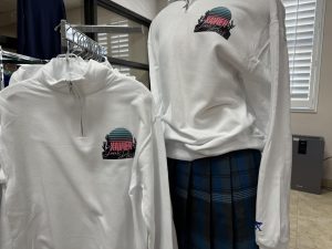 The quarter zip for the Xavier Mothers' Guild Scholarship Fashion Show is displayed in Gator Gear. The "Jewel of the Desert" takes place on April 25.