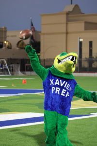 Alli Gator throws the football in the air while at Xavier’s girls flag football game. This flag football game took place on September 24, 2024 at which the Arizona Cardinals came to visit and watched the team play. 