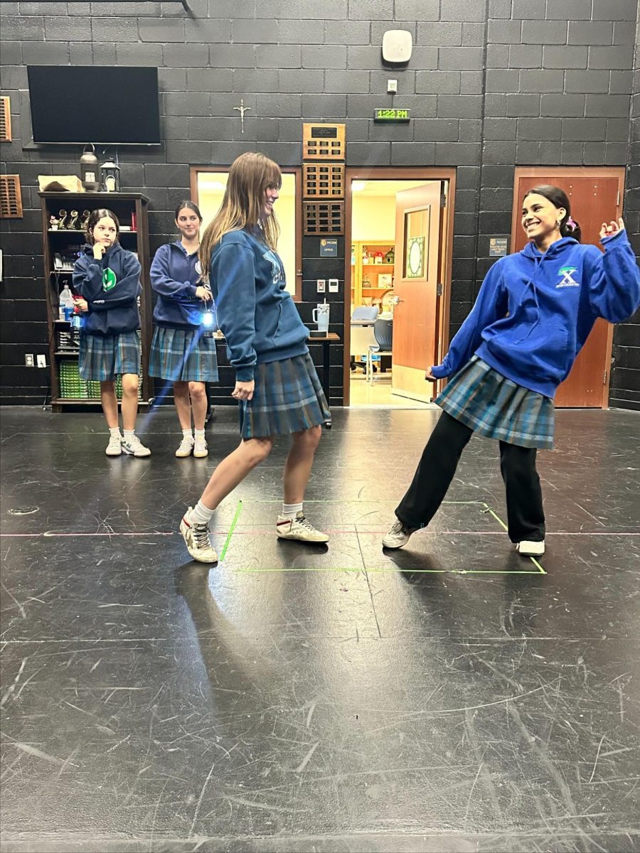 Xavier juniors Avery Stewarts, Cecily Montes, Phoebe Kleinlein and Alana Thomas practice a number in preparation for “Hadestown.” These Gators have been working since December, perfecting their choreography along the way. 