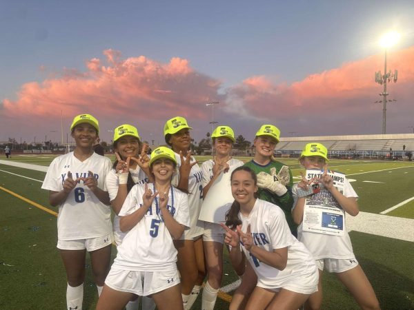 The soccer team celebrates after its win with its 5-peat hats and “State Champs!” posters.
Saturday, March 1, Xavier won its fifth state championship in a row, finishing victoriously against Casteel High School. 