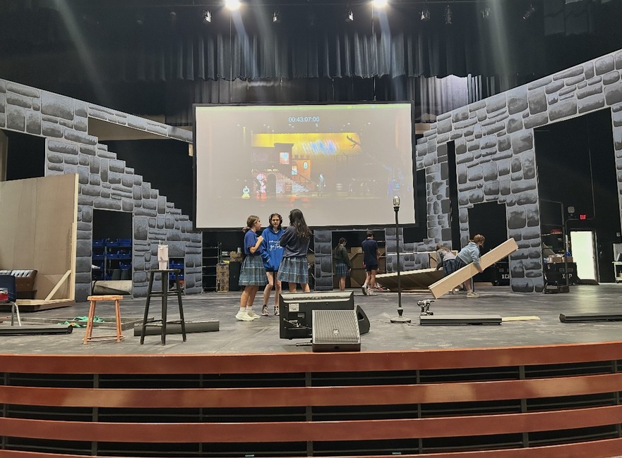 The tech crew works on the set of “Clue.” They have been working tirelessly to build the walls for the production. 