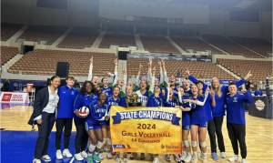 Last year’s Xavier volleyball team cheers in excitement holding the state championship banner and trophy. The Gators ended victoriously in a grueling set. The first set the Gators won 25-16, the second set 25-16, lost the third 17-25 and came up on top 27-25 to win it all.