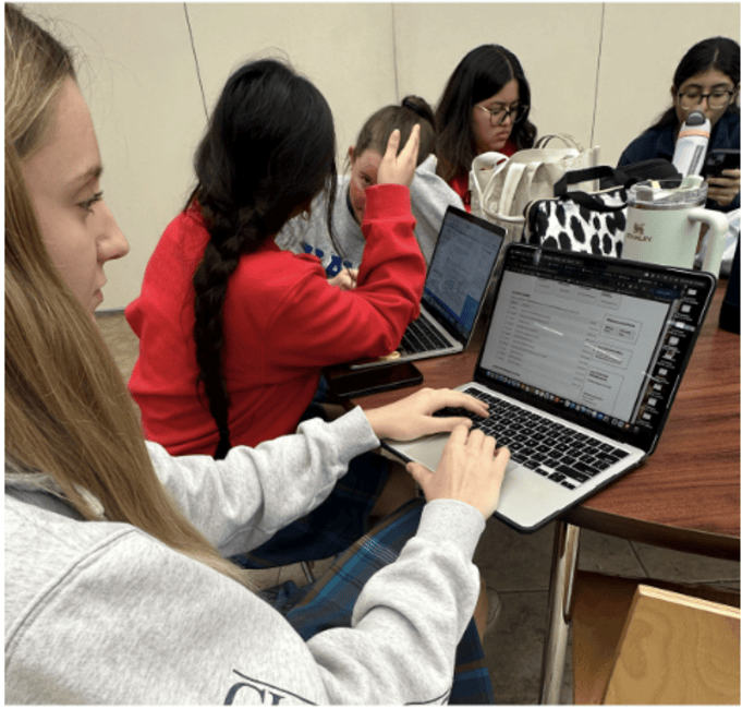 Catherine George ‘26 poses with her West Point application. Although she has already received a letter of assurance, there are still several more steps to complete.