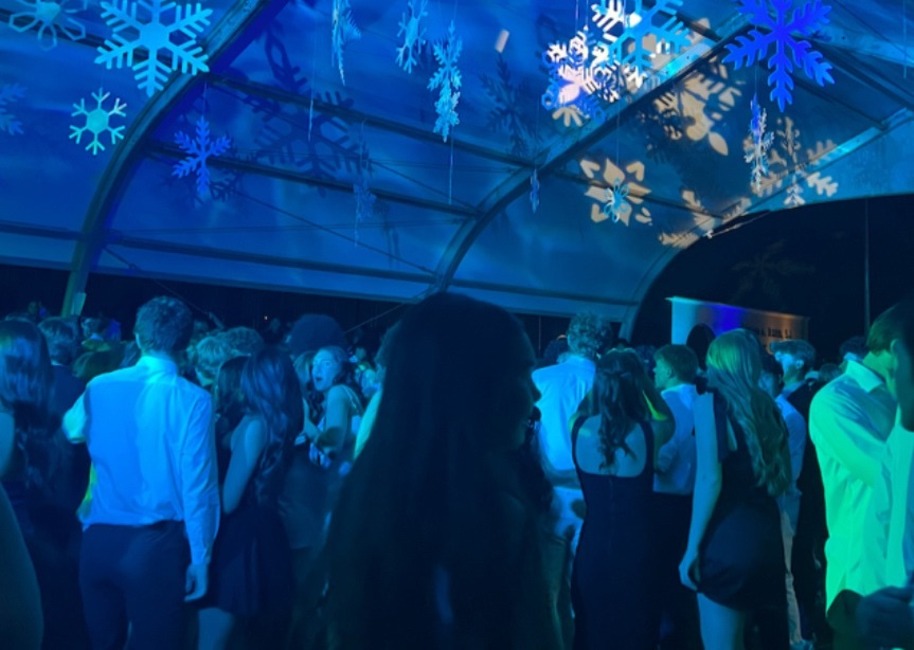 Xavier and Brophy students sing under the snow to music played by a DJ. Brophy hosts all annual school dances such as the back-to-school dance, homecoming, hoopcoming and prom.