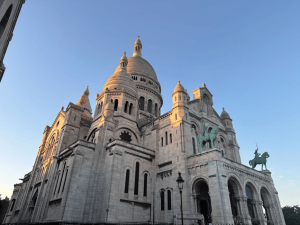 The Basilique du Sacré-Cœur is located on a hill overlooking the city in Montmartre, Paris, France. Xavier visited the Basilique as well as other churches during the 2023 trip to France.