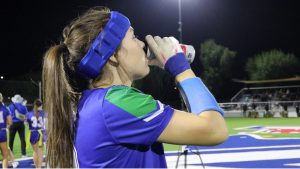Senior Cooper Hidalgo drinks a Celcius energy drink before a flag football game. Energy drinks have become a common pre-game drink for many student athletes.