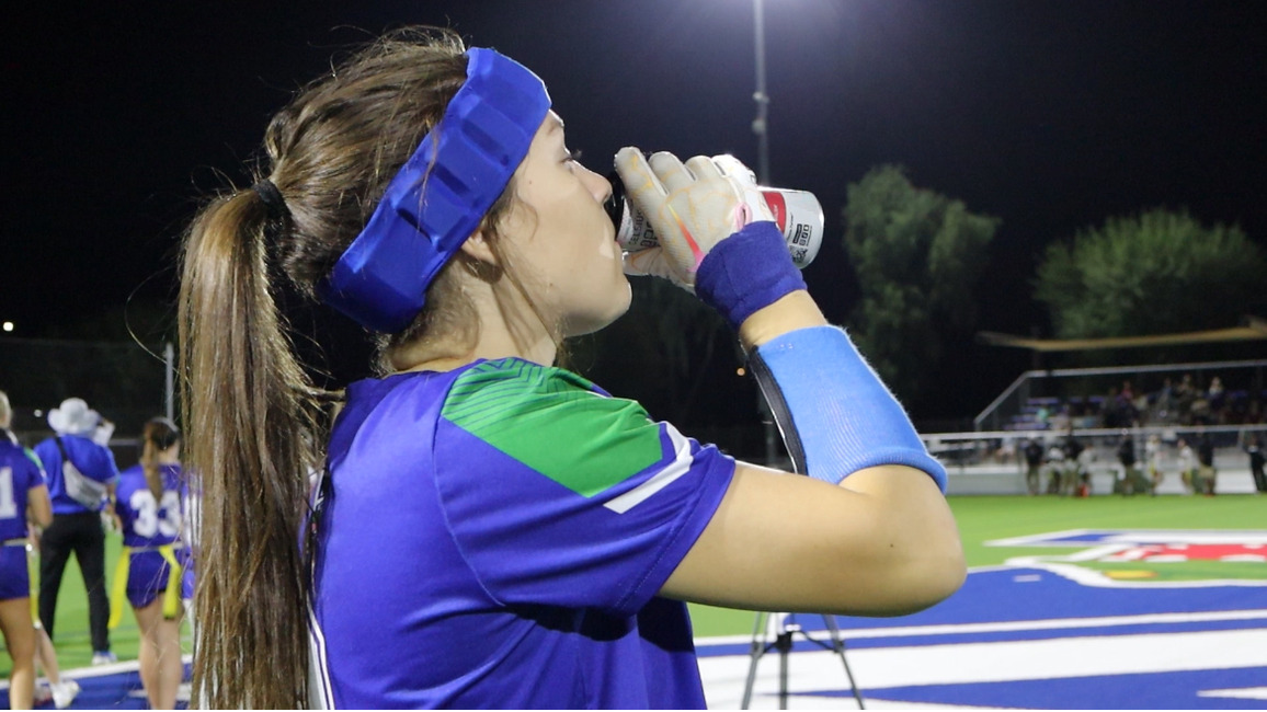 Senior Cooper Hidalgo drinks a Celcius energy drink before a flag football game. Energy drinks have become a common pre-game drink for many student athletes.