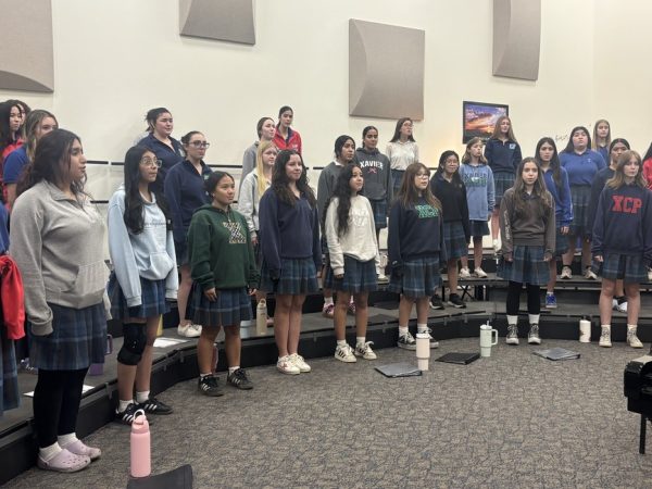 Xavier choir members rehearse in the choir room for their Christmas pageant. Students regularly practice their harmony and connection together during the afternoon classes.